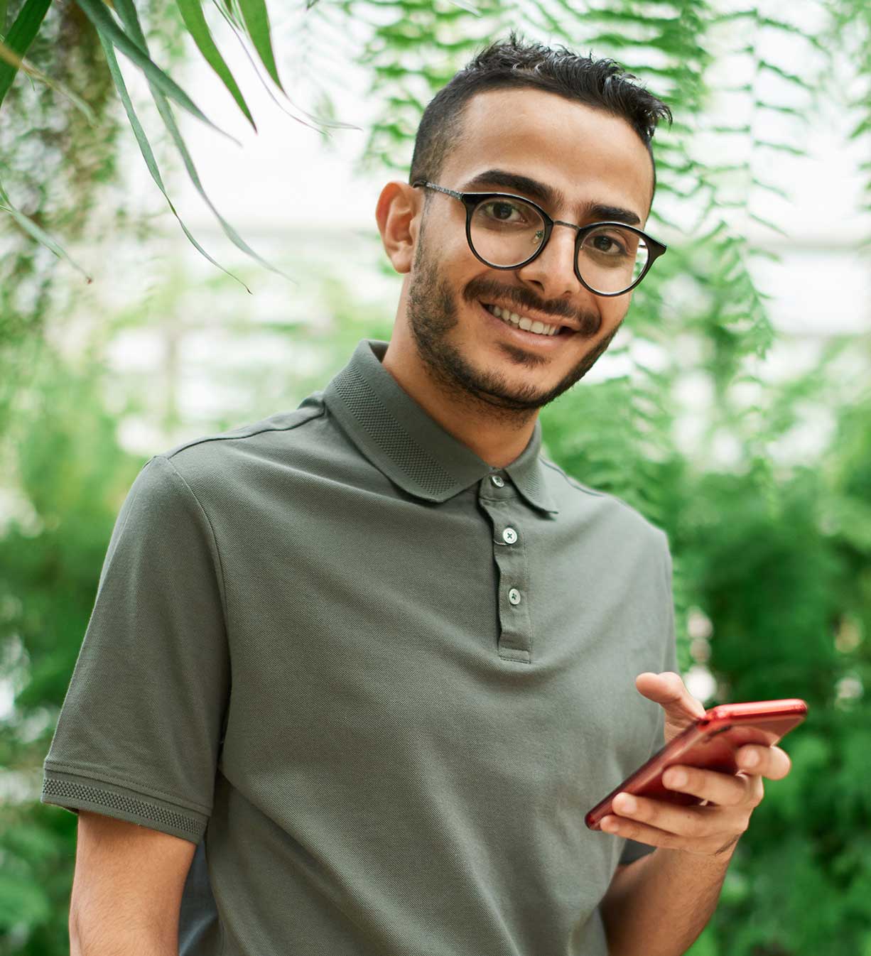Man with Glasses with Phone in his Hand Man with Glasses with Phone in his Hand